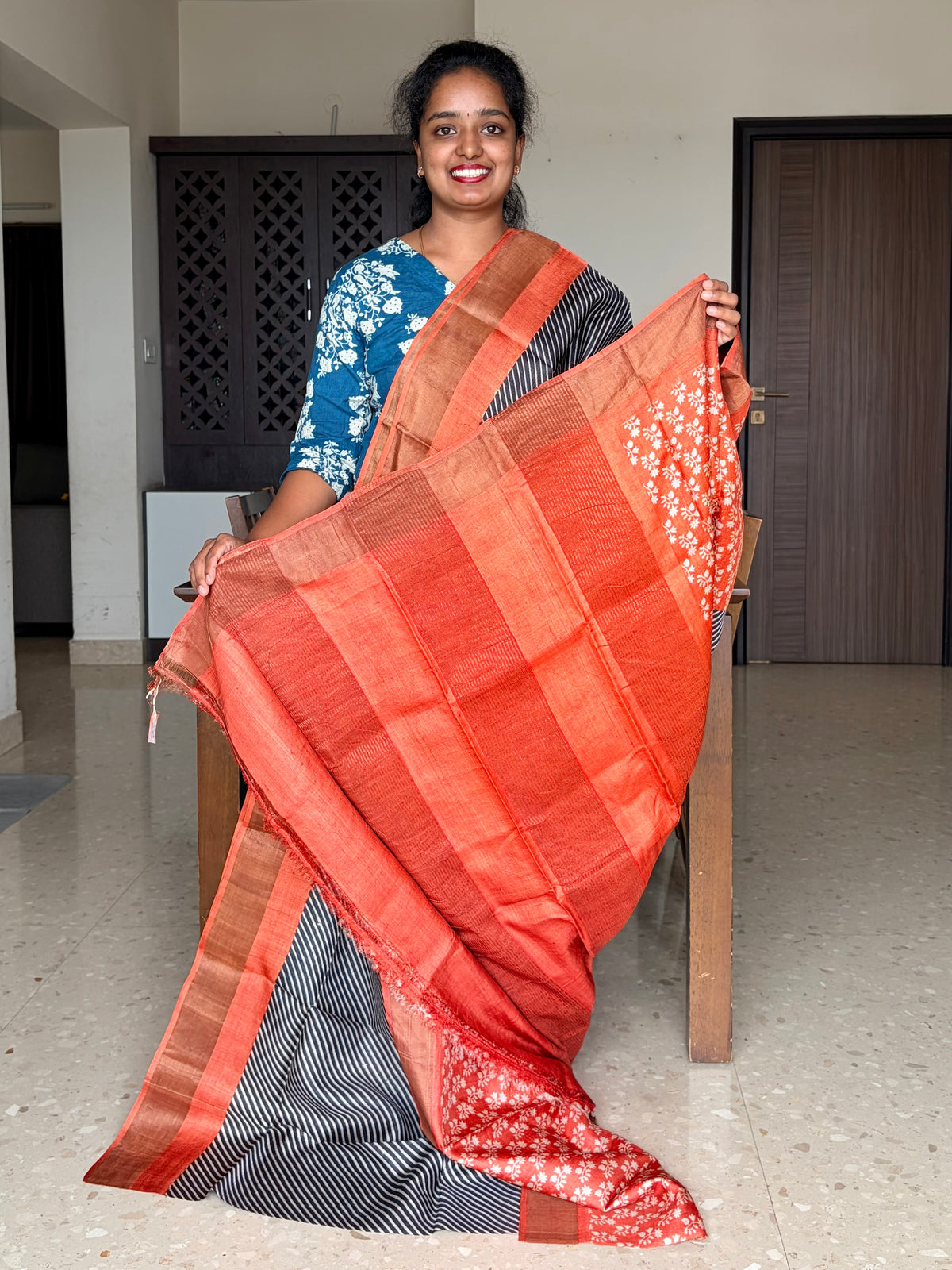 Black and Orange Tussar Silk Saree with Prints