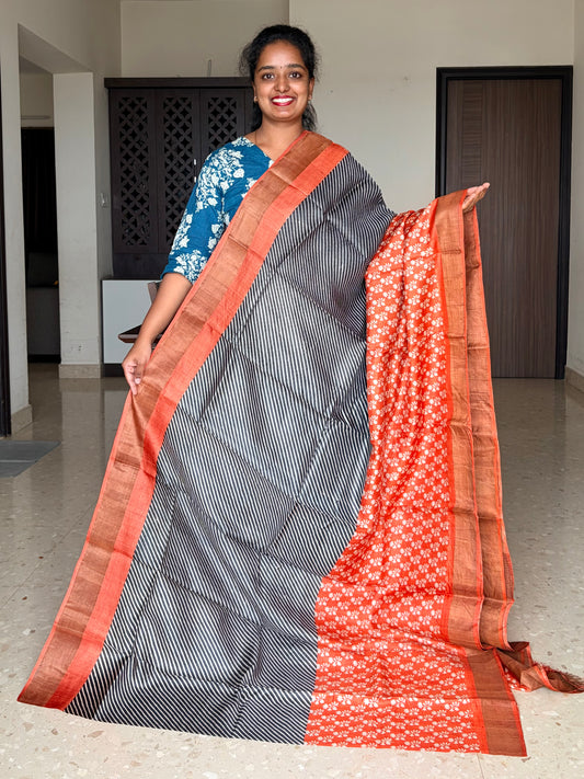 Black and Orange Tussar Silk Saree with Prints