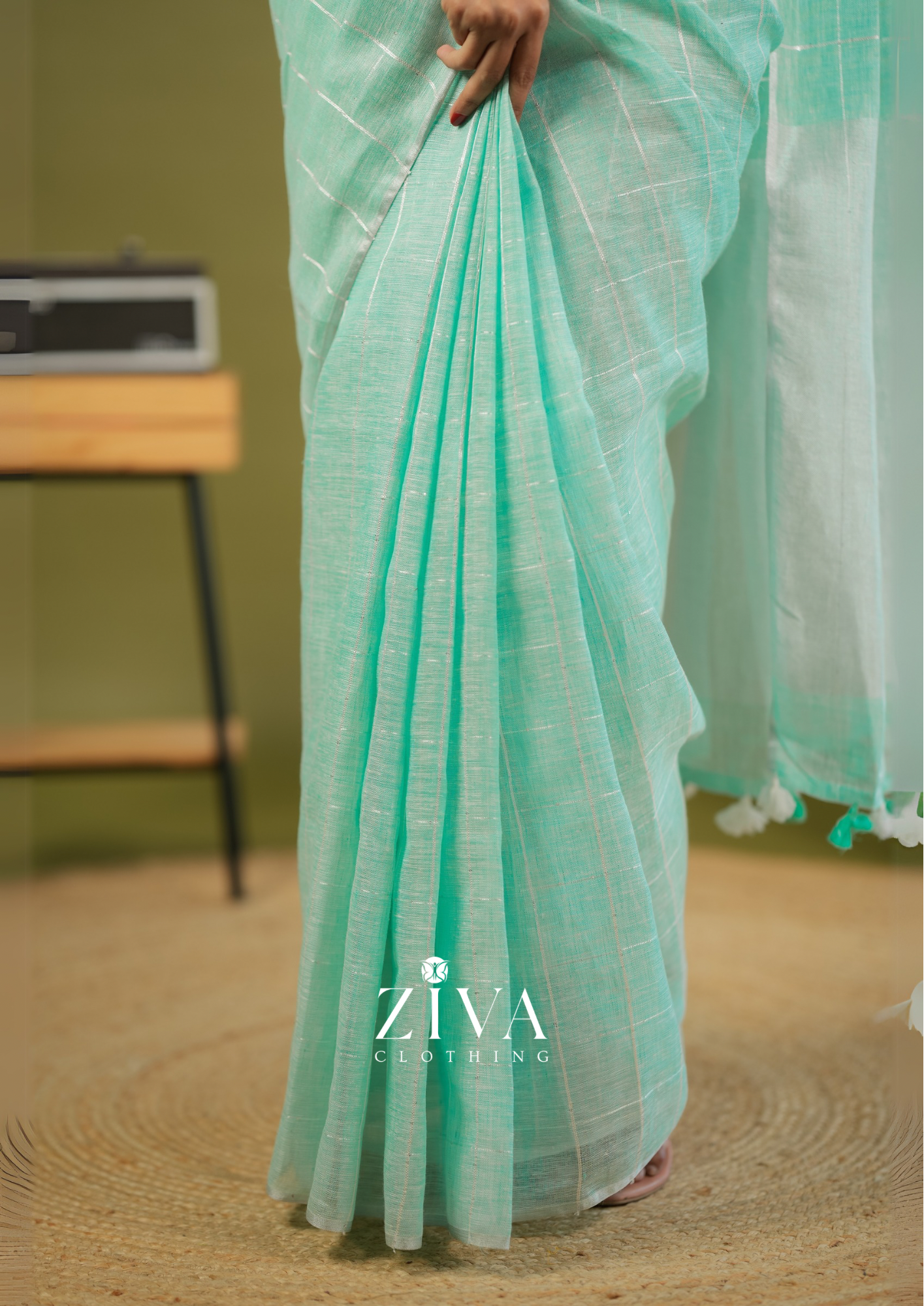 Pastel Green Linen Saree Woven With Sequins